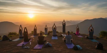 Diverse travelers practicing yoga on a mountain, sunrise, transformative travel